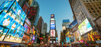 Amazing vibrant Times Square crowded with tourists and people sightseeing. New York City, Manhattan, USA.