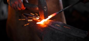 Photo illustrating concept of striking while the iron is hot.